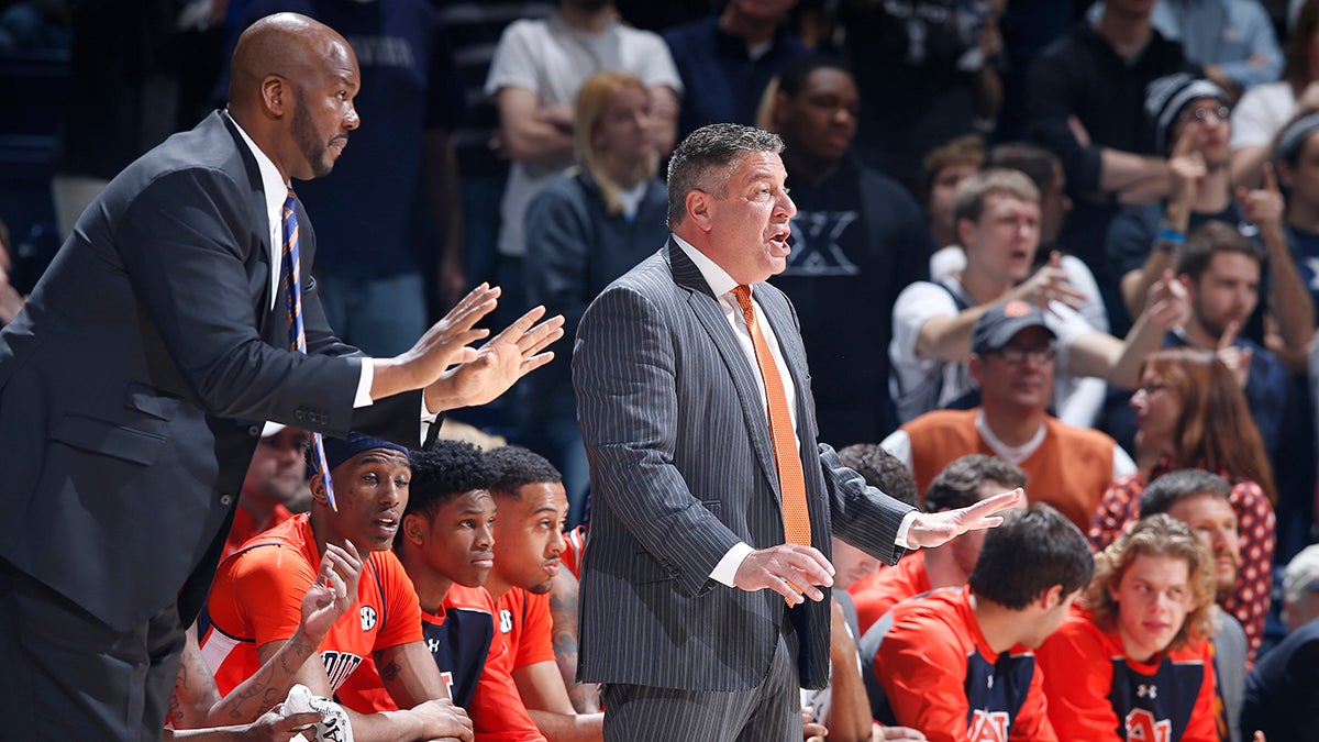 Auburn assistant coach Chuck Person coaching alongside head coach Bruce Pearl