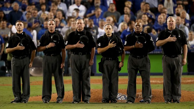 Umpires standing on a baseball field