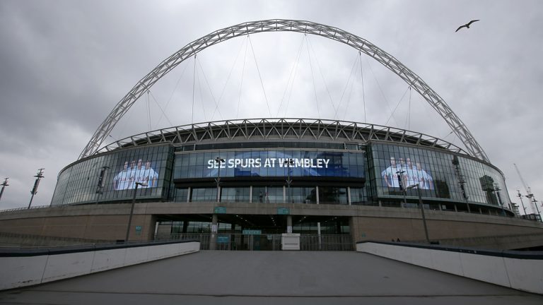 Wembley Stadium in London advertises a Tottenham Hotspurs football match