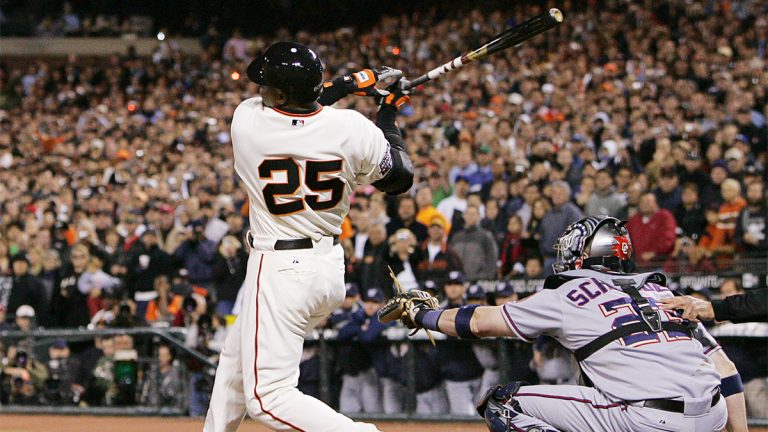 Barry Bonds swings and breaks home run record