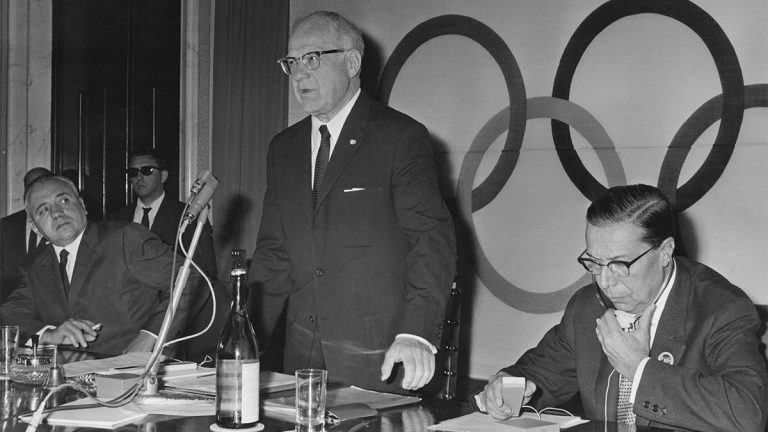 Avery Brundage stands to speak at an International Olympic Committee meeting in 1965