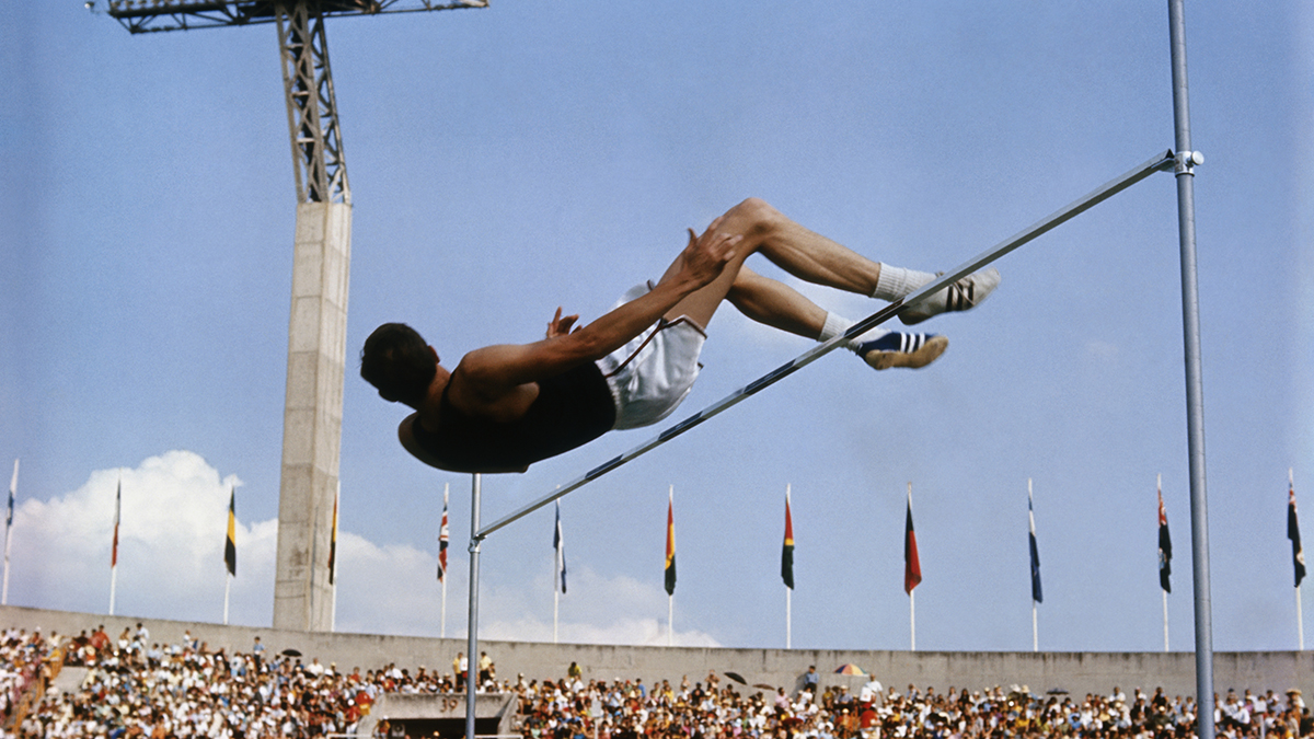 Dick Fosbury soars over the bar during the men’s high jump at the 1968 Olympics in Mexico City