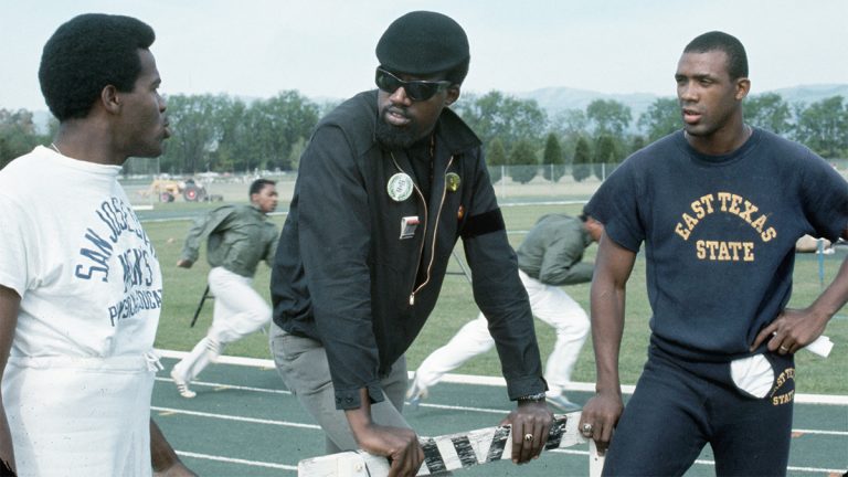 Harry Edwards talks with Tommie Smith and John Carlos