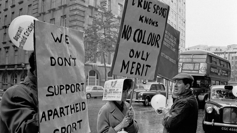 Anti-apartheid demonstrators protest outside the Waldorf Hotel in London where South African cricketers are staying in 1965