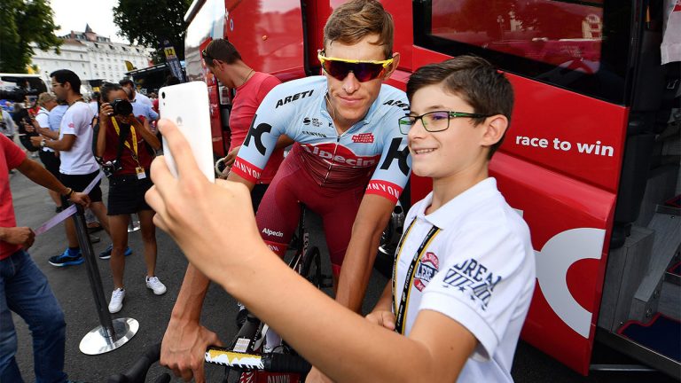 Kid taking a selfie with German cyclist Nils Pollit