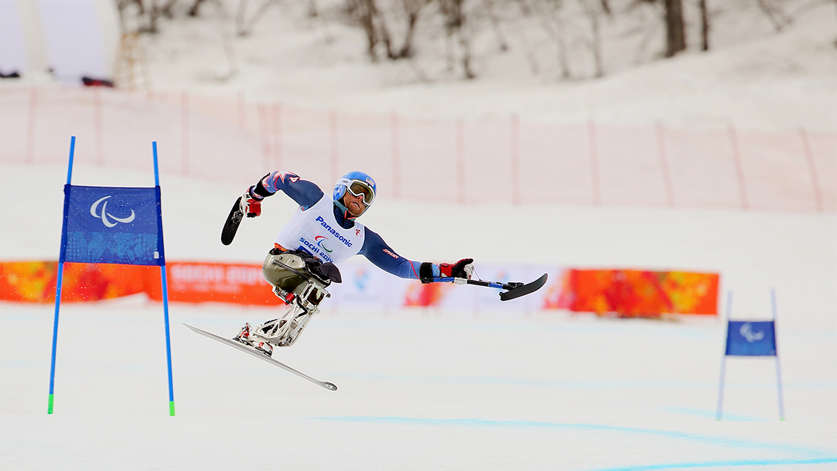Adaptive skier Tyler Walker of the United States in action as he skiis downhill on day one of the Sochi 2014 Paralympic Winter Games.
