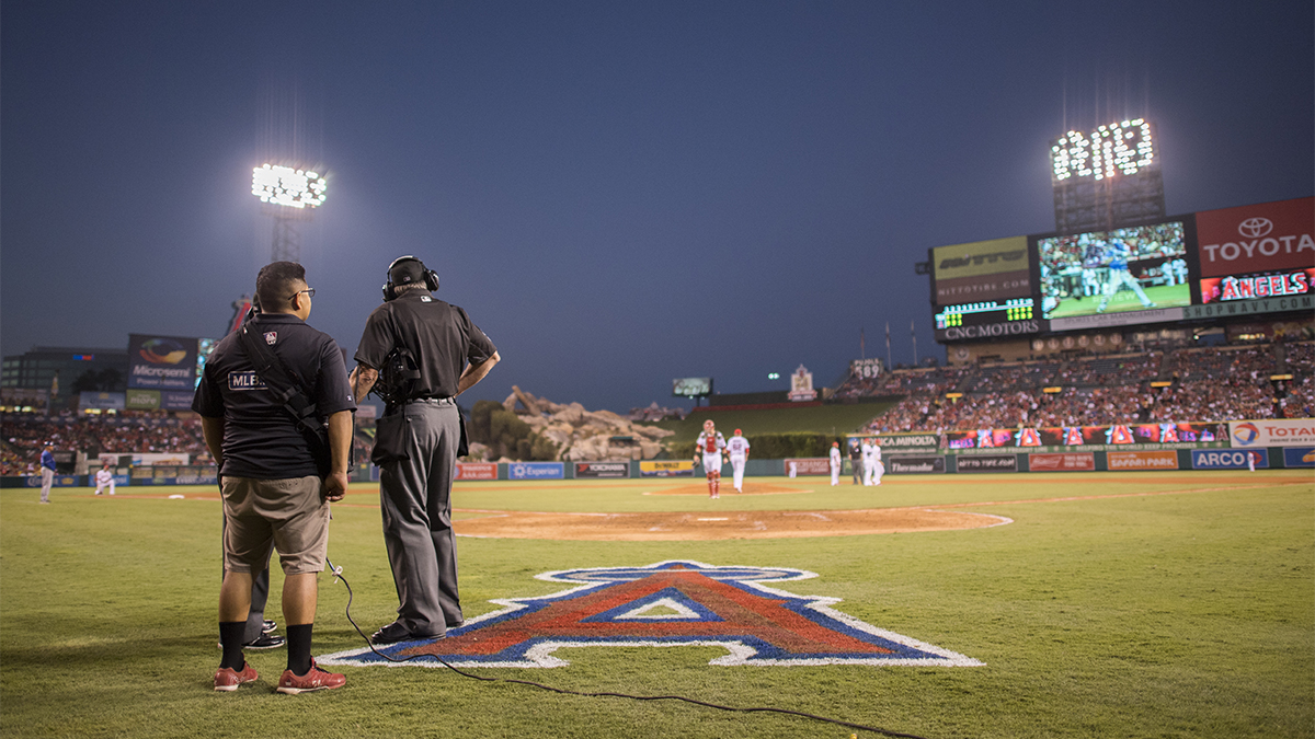 Umpire Mike Winters looks out into the field during a replay in a 2016 game between the Texas Rangers and Los Angeles Angels.