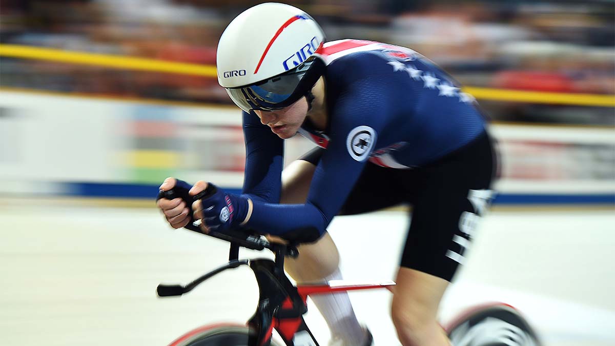 Kelly Catlin on bike with goggles and helmet