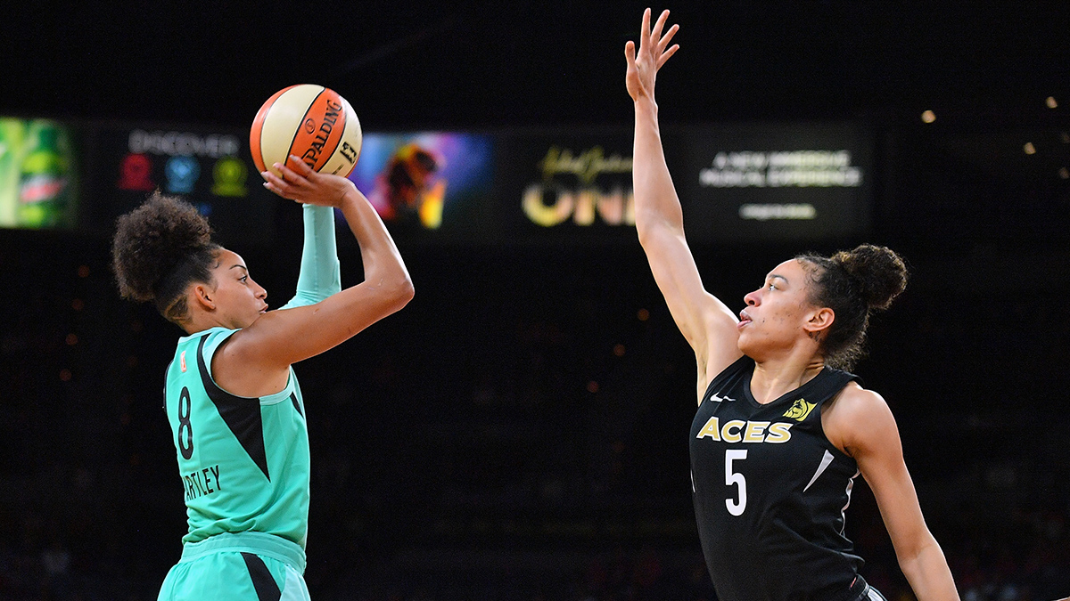 WNBA player Bria Hartley shooting the ball over a defender