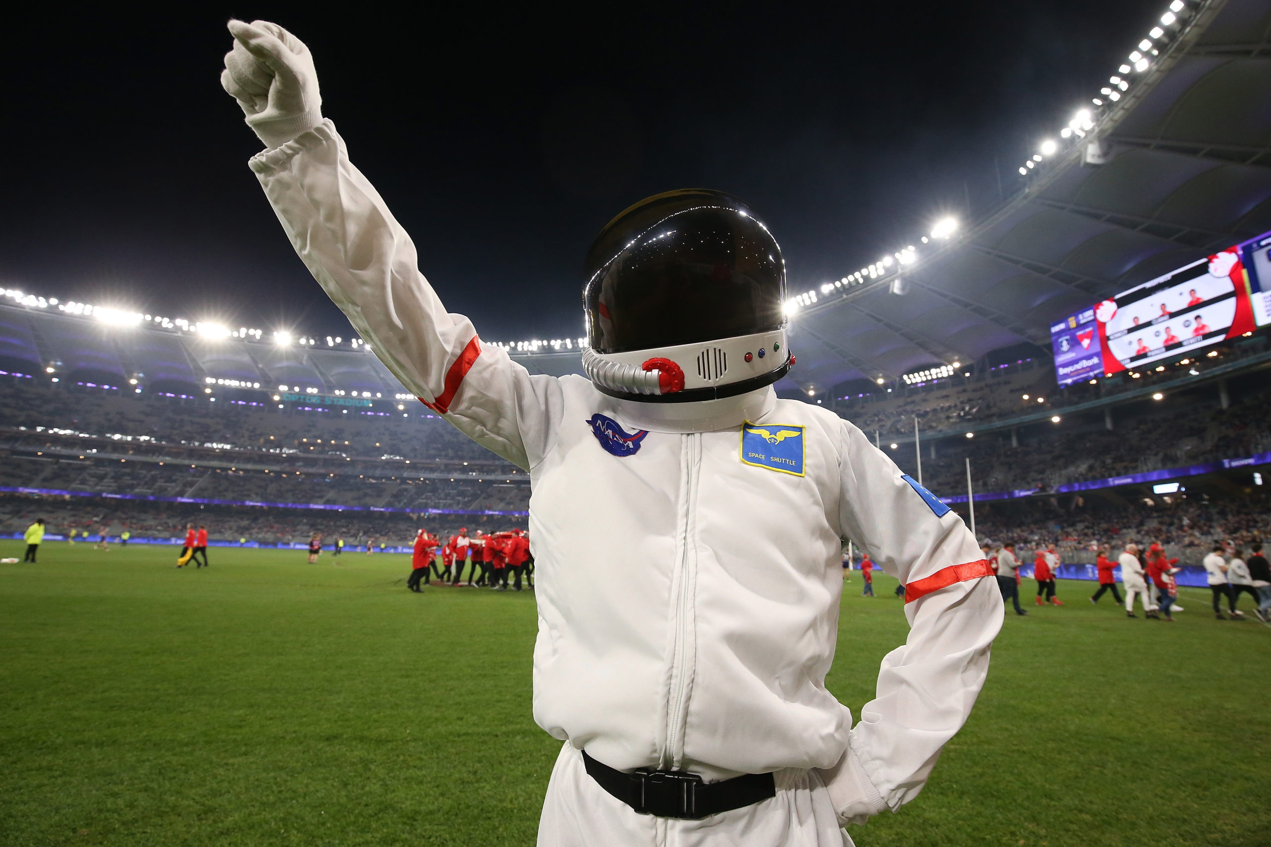 PERTH, AUSTRALIA - JULY 20: A mascot dressed an astronaut poses to commemorate the Apollo 11 moon landing during the round 18 AFL match between the Fremantle Dockers and the Sydney Swans at Optus Stadium on July 20, 2019 in Perth, Australia. (Photo by Paul Kane/Getty Images)