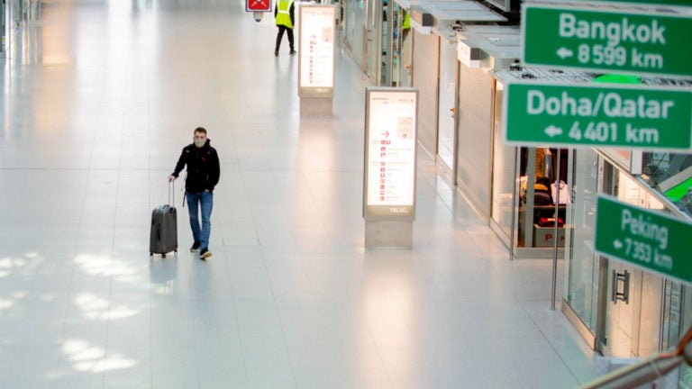 15 June 2020, Berlin: A passenger walks through the largely empty Terminal A at Berlin-Tegel Airport. The travel warning for 27 European countries was lifted during the night to Monday (15.06.2020). Photo: Christoph Soeder/dpa (Photo by Christoph Soeder/picture alliance via Getty Images)