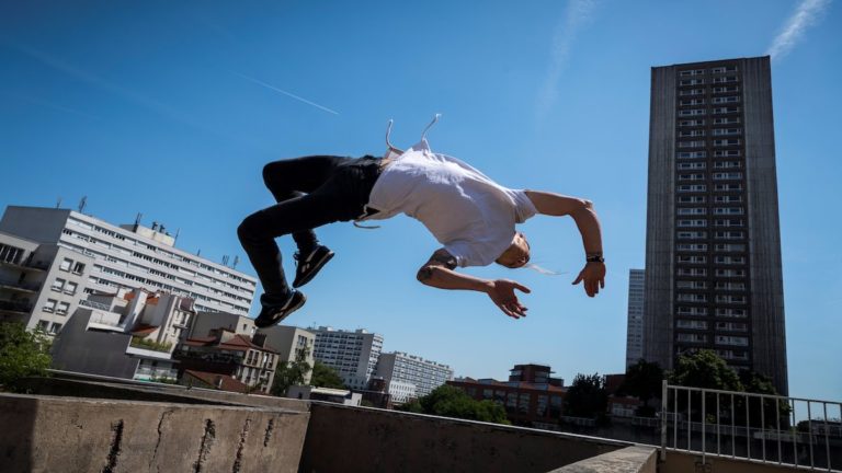 Man doing Parkour in a city