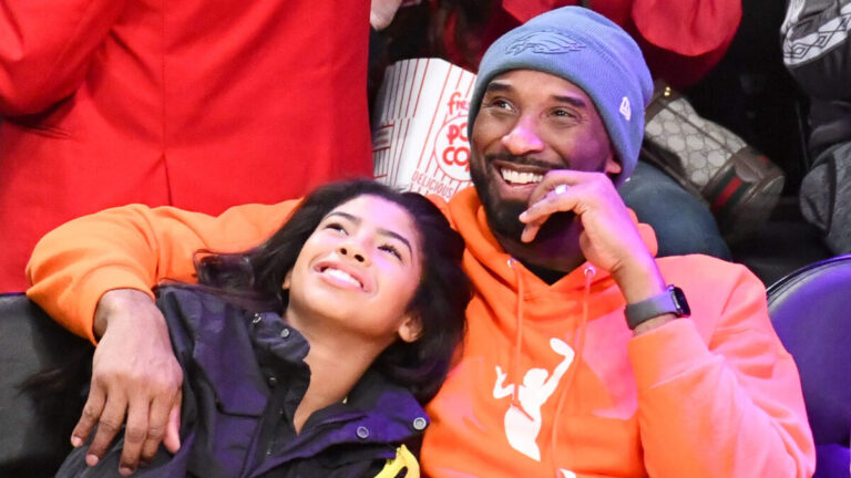 Kobe and Gianna Bryant courtside at a basketball game