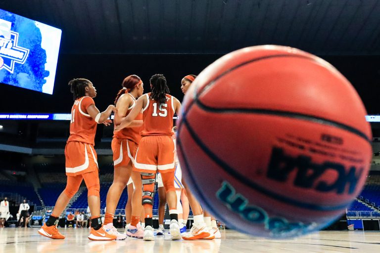 SAN ANTONIO, TEXAS - MARCH 24: Texas Longhorns huddle during the second half against the UCLA Bruins in the second round game of the 2021 NCAA Women's Basketball Tournament at the Alamodome on March 24, 2021 in San Antonio, Texas. (Photo by Carmen Mandato/Getty Images)