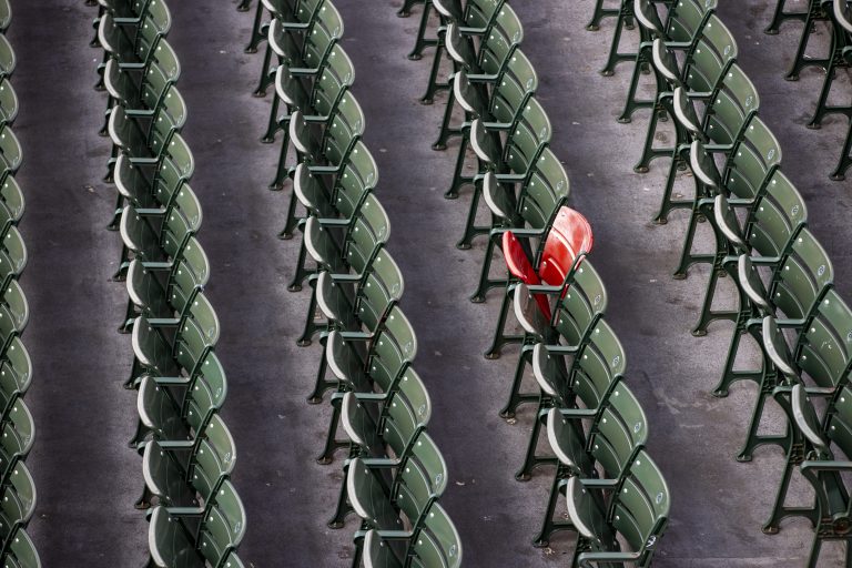 BOSTON, MA - APRIL 16: The red seat, which celebrates the longest home run hit in Fenway Park by Ted Williams, in the bleachers on April 16, 2020. Fenway Park in Boston remains closed during the coronavirus emergency. (Photo by Stan Grossfeld/The Boston Globe via Getty Images)