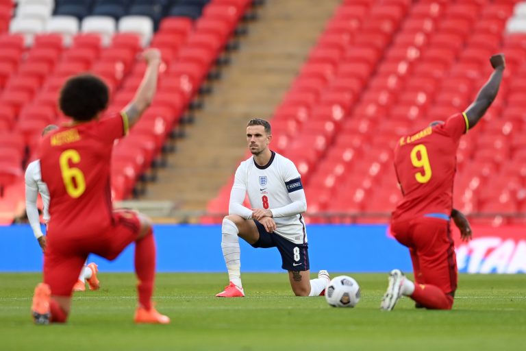 Footballers protest before a FIFA qualifying match.