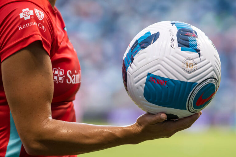 KC Current player holding NWSL ball